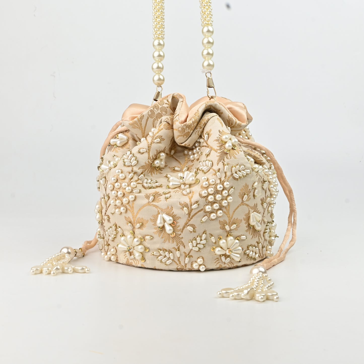 Banaavat Essence Off White Silk Brocade Potli – Pearl Embellished with Circular Base