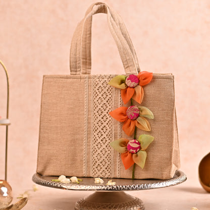 Jute Hamper Bag with Multicolor Handcrafted Flowers and 4 Tissue Potlis