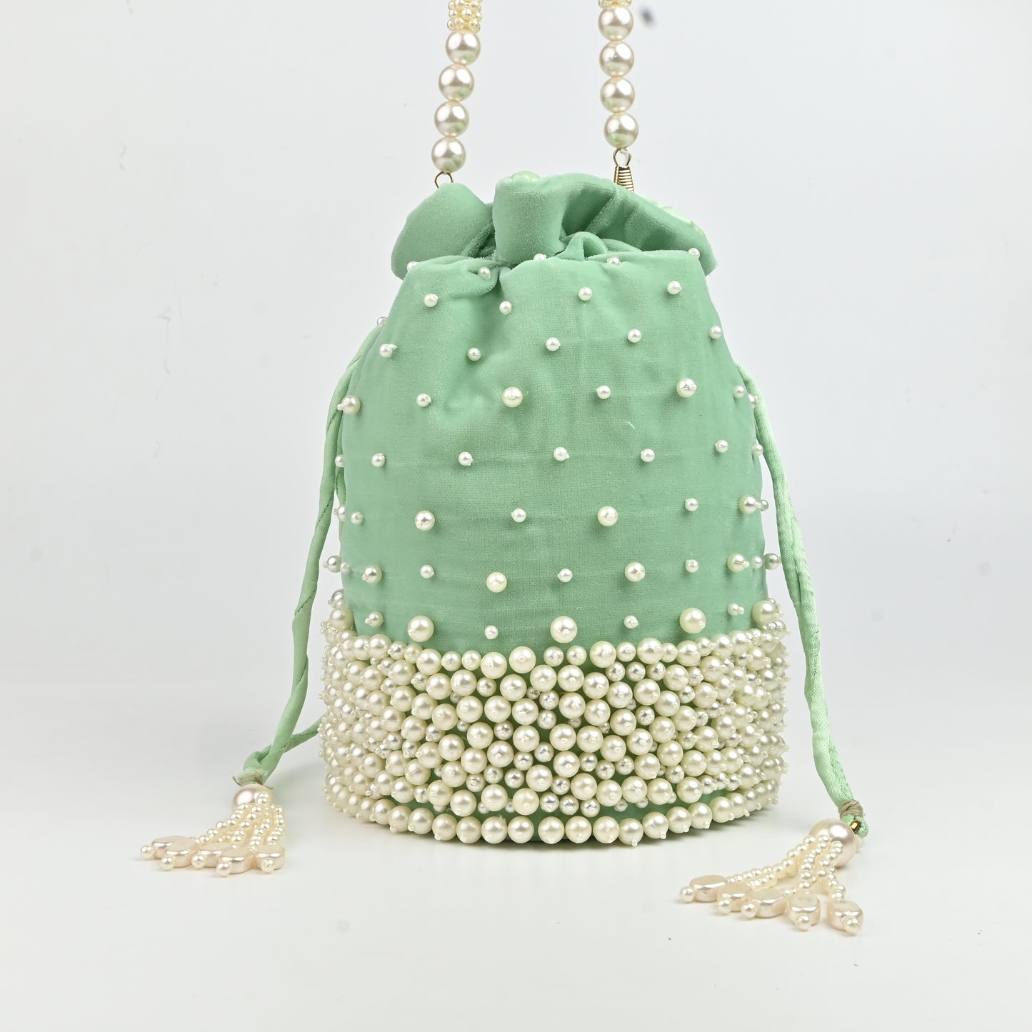 Banaavat Essence Sea Green Velvet Potli – Pearl Karigari & Cylindrical Design with Circular Base