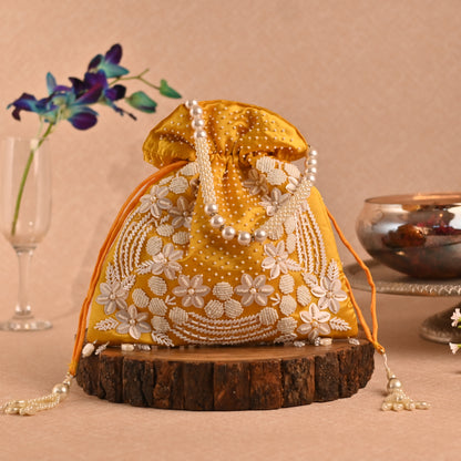 Banaavat Essence Muslin Silk Potli – White Bead & Pearl Embellished (Pastel Blue, Red & Yellow)