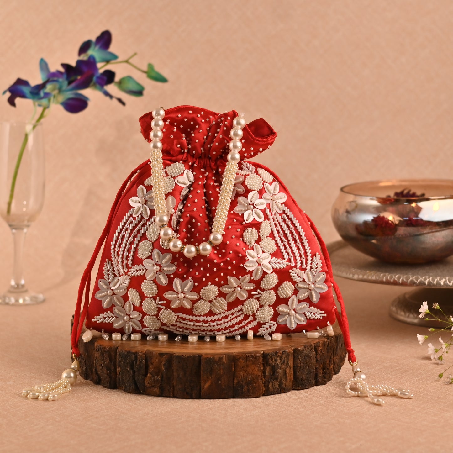 Banaavat Essence Muslin Silk Potli – White Bead & Pearl Embellished (Pastel Blue, Red & Yellow)